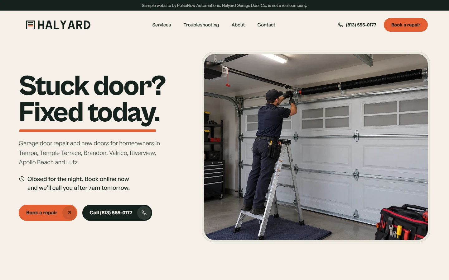 The Halyard Garage Door Co. sample homepage on a computer: the headline "Stuck door? Fixed today." beside a photo of a technician repairing a garage door, with buttons to book a repair or call.
